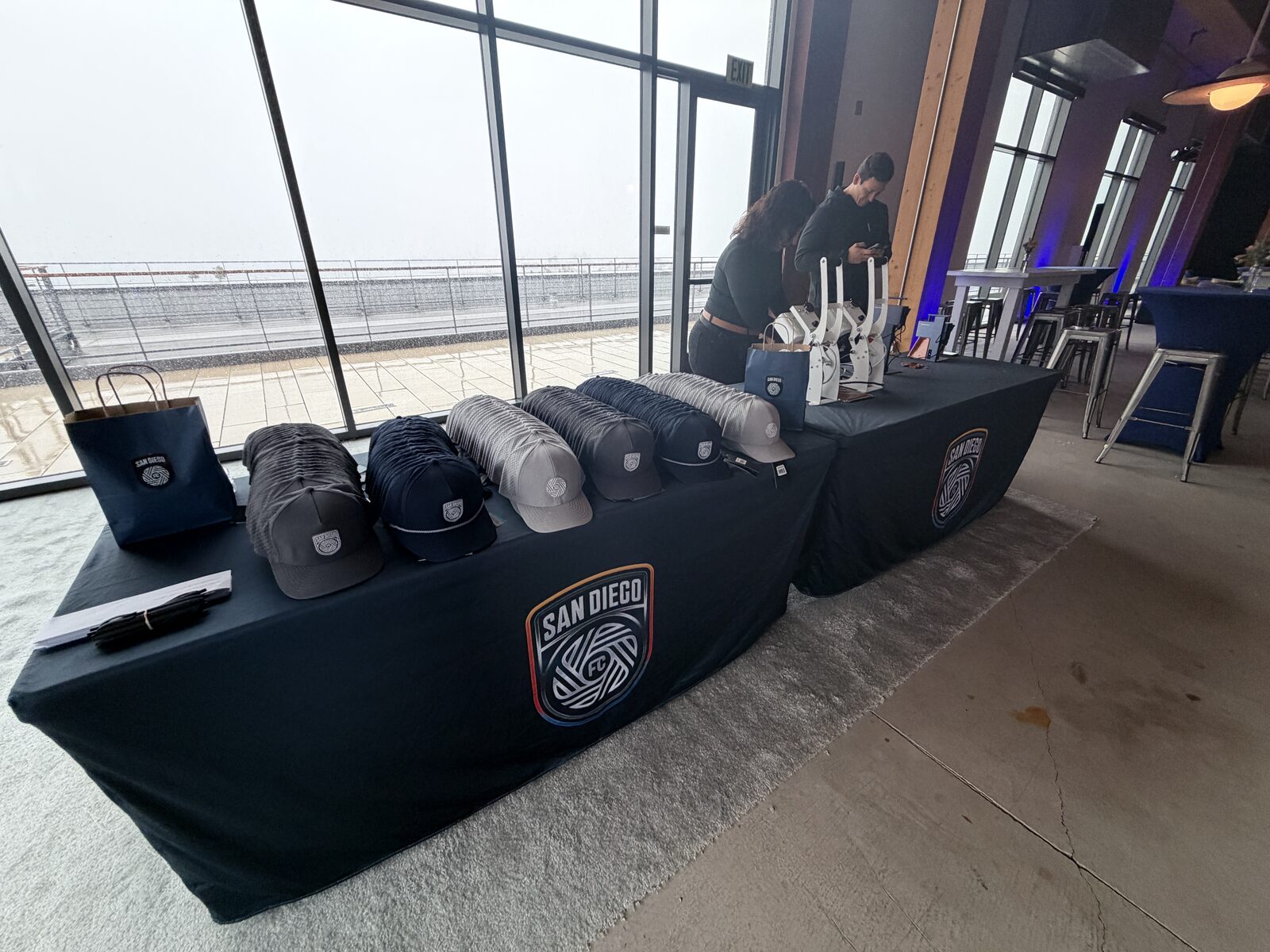 Lineup of blank caps in assorted styles and colors on a party hat bar table