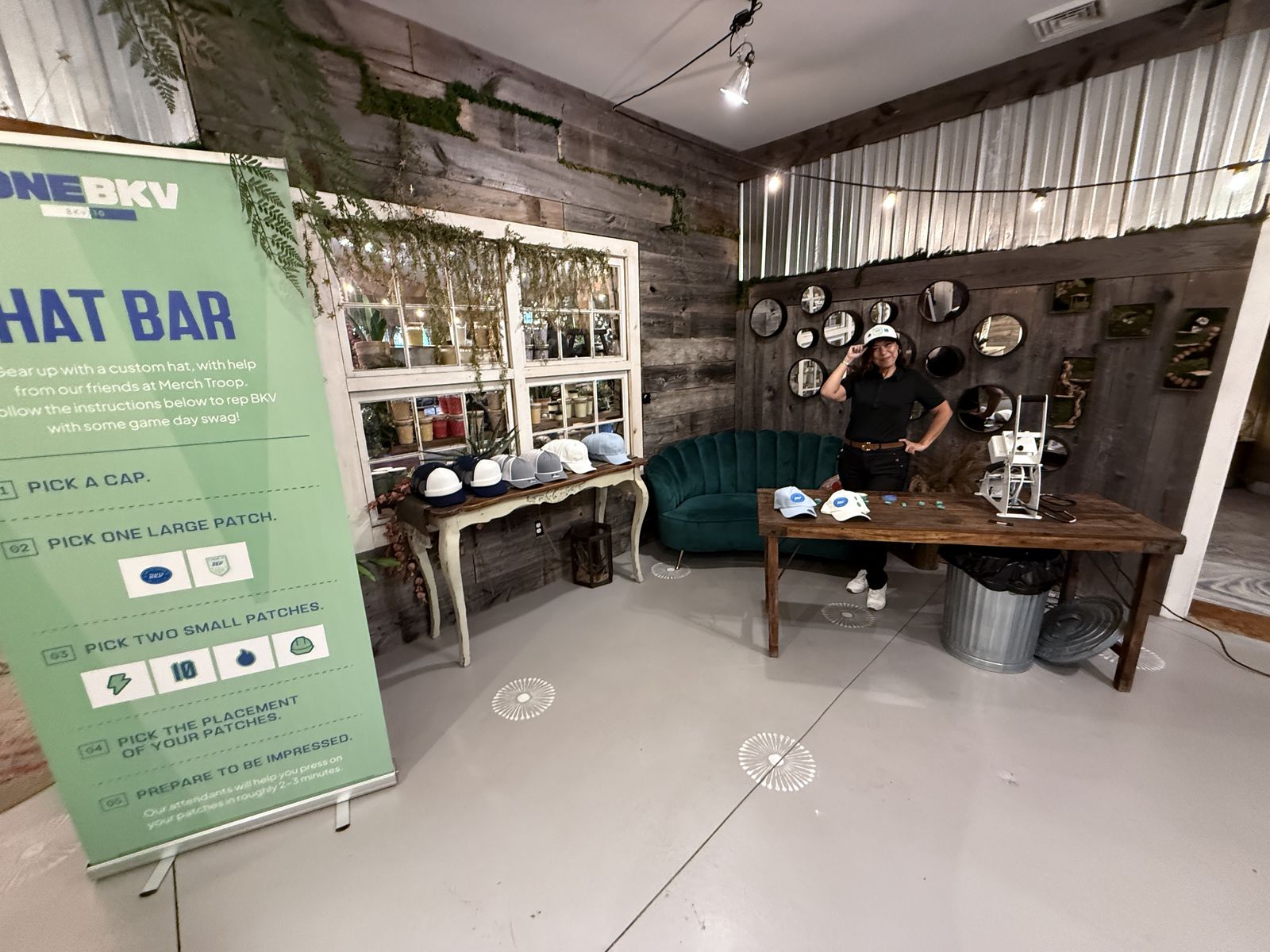 Hat bar built into a lounge corner during a rooftop birthday party