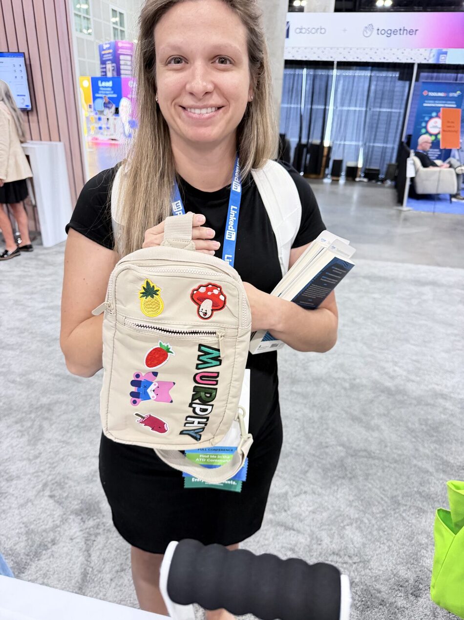 Sling bag covered in pressed patches made at a party station